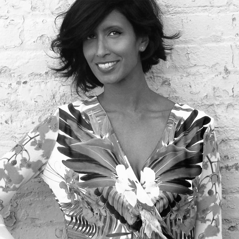 A black and white photo portrait of designer Aasha Ramdeen 