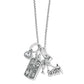 Brighton silver-plated charm necklace with crystal solitaire, dream tag, cocktail dress, and 2021 charms on a white background