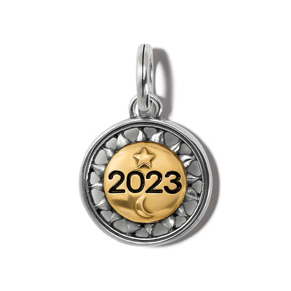 Brighton round charm with gold-tone 2023 center, star and moon accents, and silver-tone patterned border on a white background