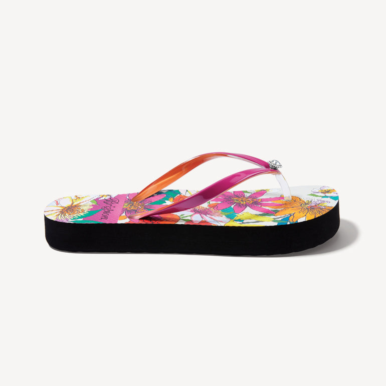 Side view of a flip flop with a tropical print