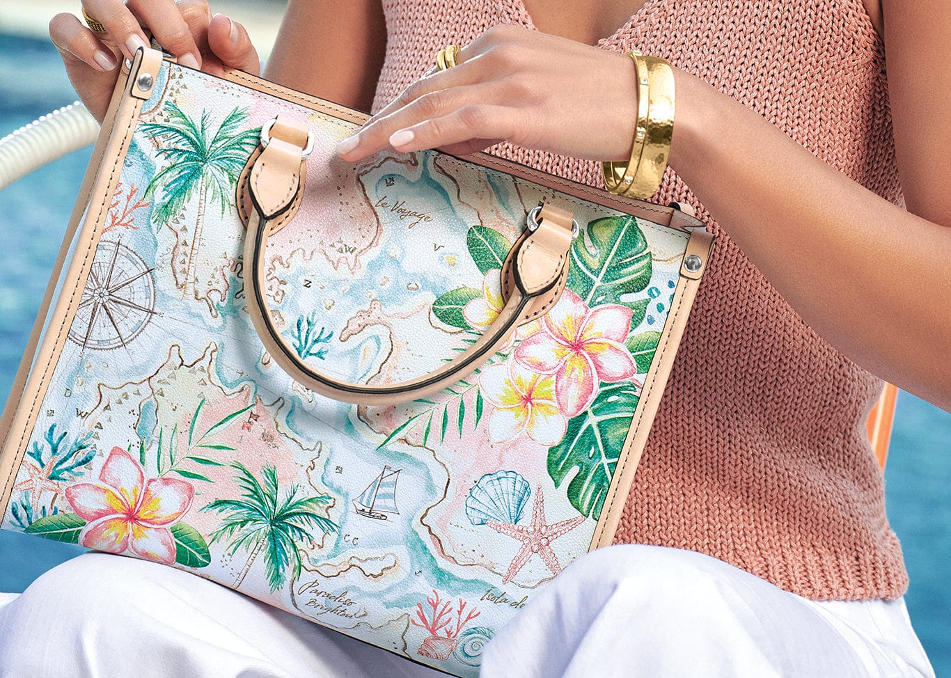 A model holding the Voyage Tote