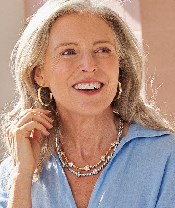 A model wearing Meridian jewelry