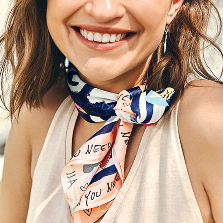 A model wearing a scarf around her neck