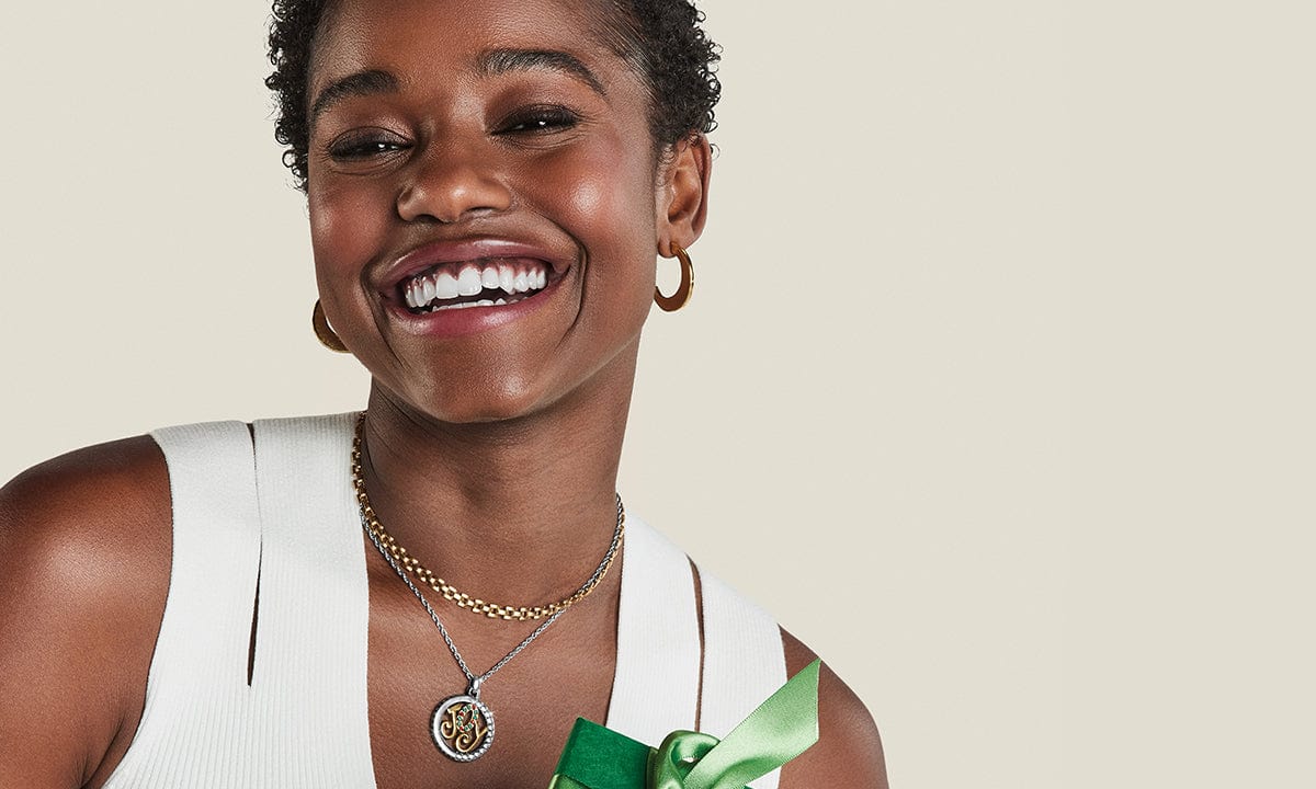 model wearing 'Joy' holiday necklace