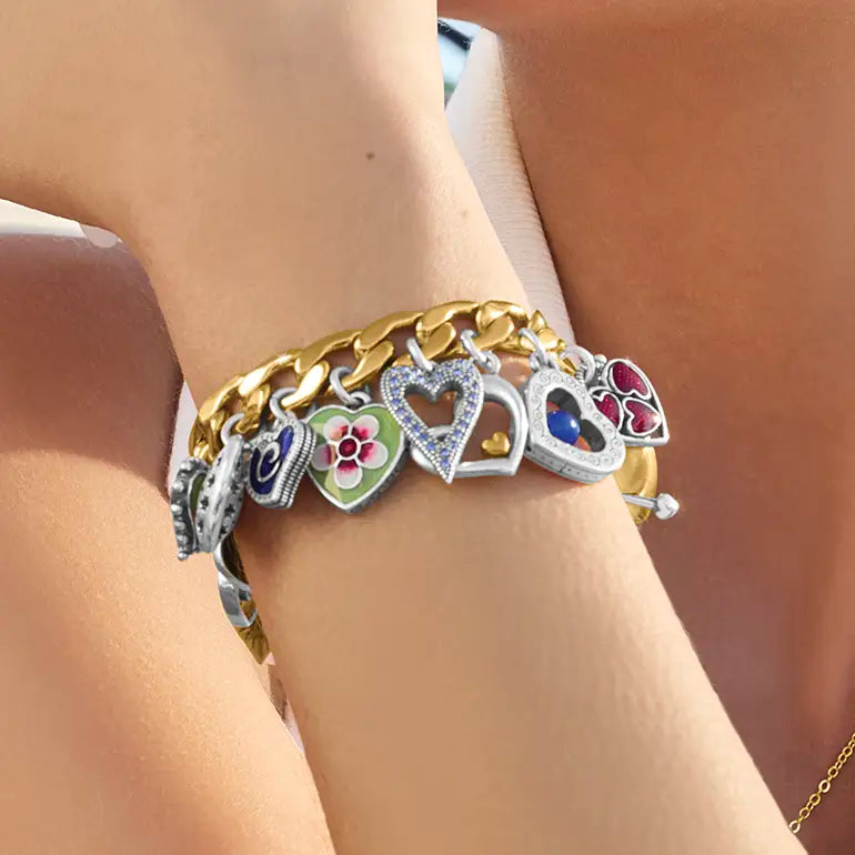Brighton Bracelet with heart-shaped charms on a wrist against a neutral background
