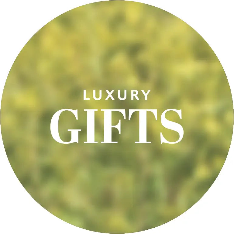 Circular logo with 'Luxury Gifts' text on a blurred green background
