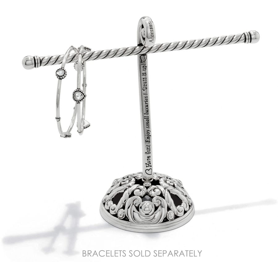 Brighton silver-plated jewelry stand with ornate scrolled base and engraved script text, displaying bangles on a white background