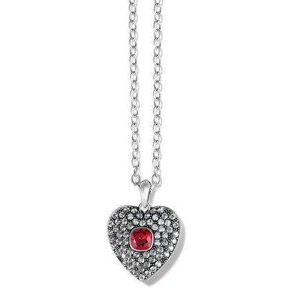 Brighton pendant necklace with silver-plated heart, pavé crystals, and red center stone on a white background