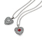 Brighton pendant necklaces with silver-plated heart charms featuring crystal pavé and clear and red center stones on a white background