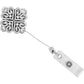 Brighton retractable badge clip with silver-plated scrollwork square, crystal accents, and clip attachment on a white background