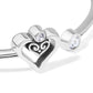 Close-up of Brighton silver-plated bracelet with open heart scroll motif and clear crystal accents at ends