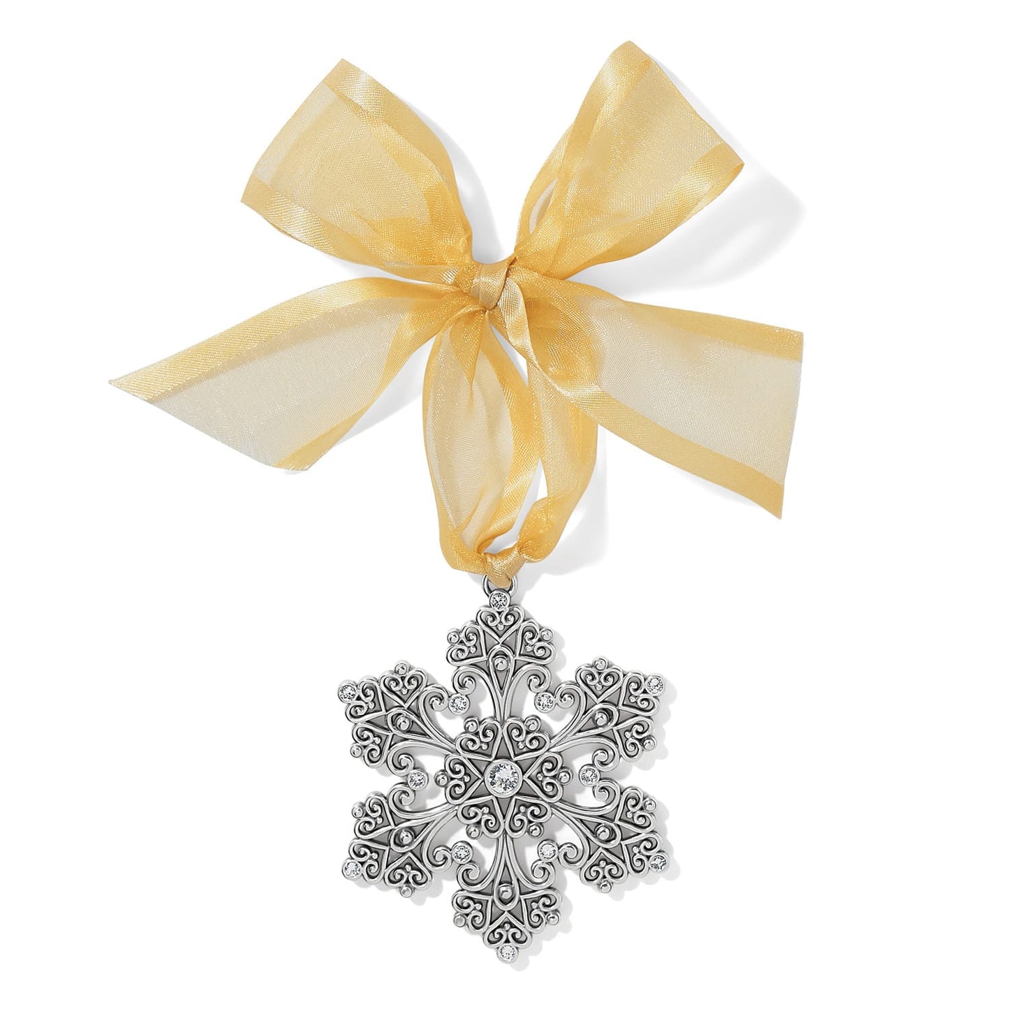 Brighton silver-plated snowflake ornament with scrollwork design and crystal accents tied with sheer gold ribbon on a white background