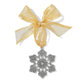 Brighton snowflake ornament with silver-plated filigree scrollwork design and gold organza ribbon bow on a white background