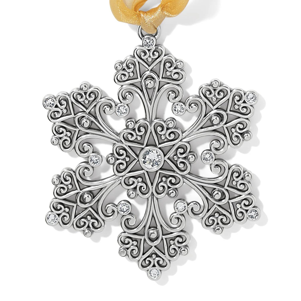 Brighton snowflake ornament with silver-plated filigree scrollwork, crystal accents, and gold ribbon on a white background