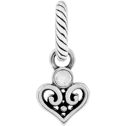 Brighton heart charm with silver-plated filigree scrollwork, crystal accent, and twisted rope bail on a white background