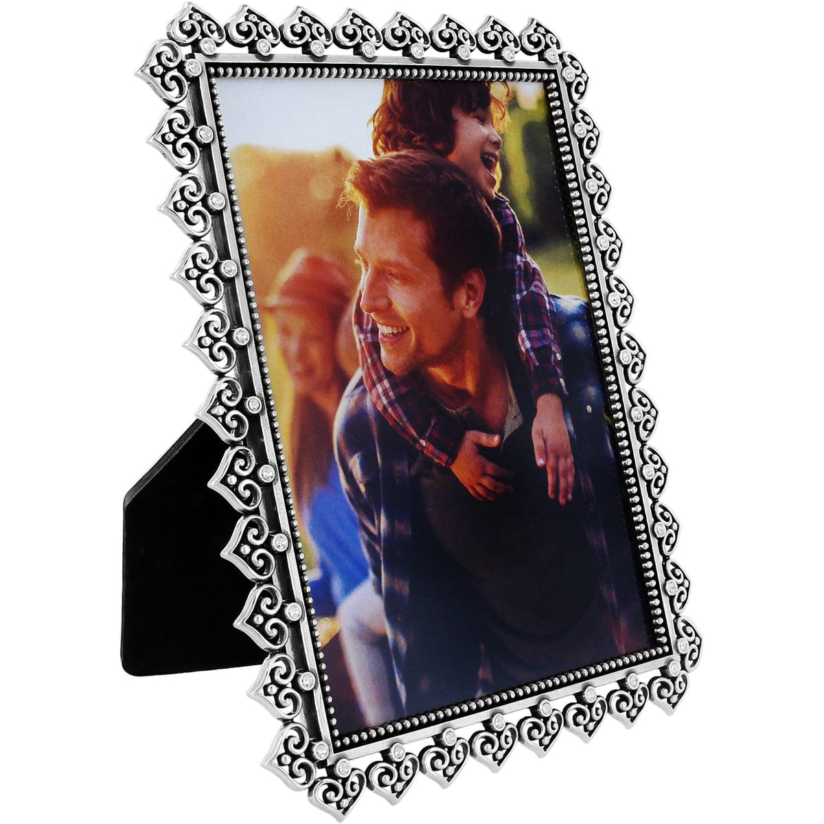 Brighton picture frame with silver-plated ornate scrollwork border and crystal accents surrounding a family photo on a white background