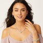Model wearing a Brighton beaded necklace with silver-plated heart pendant and coordinating Brighton accessories