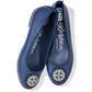 Brighton navy blue leather ballet flats with silver-tone medallion ornament and pebbled texture on a white background