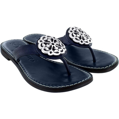 Brighton navy leather thong sandals with silver-tone ornamental medallion accents and contrast stitching on a white background