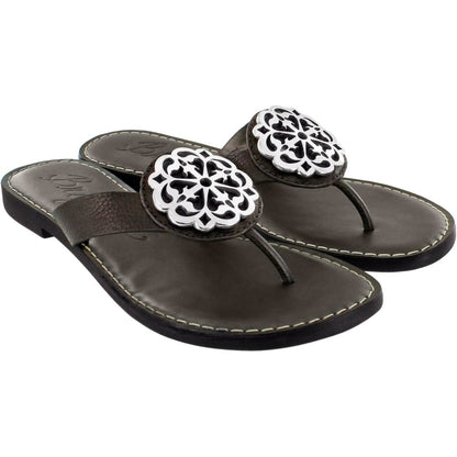 Brighton thong sandals in brown leather with ornate silver-tone medallion accents at the toe straps on a white background
