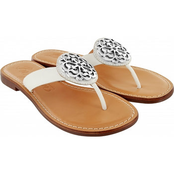 Brighton white thong sandals with ornate silver-tone medallion accents and tan leather footbeds on a white background
