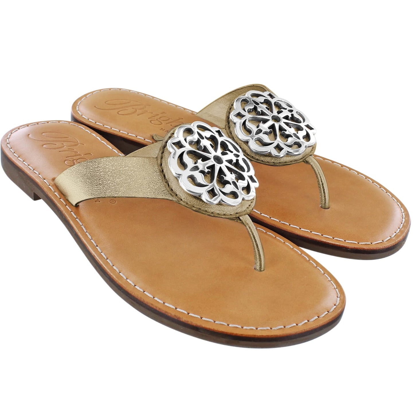 Brighton thong sandals in tan leather with gold straps and silver-tone ornate medallion accents on a white background