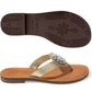 Brighton thong sandals with gold metallic strap, silver-tone medallion accent, and patterned brown sole on a white background