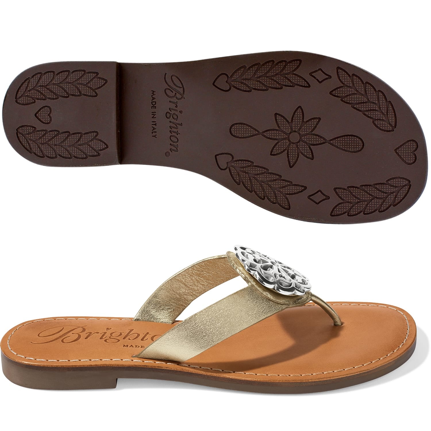 Brighton thong sandals with gold metallic strap, silver-tone medallion accent, and patterned brown sole on a white background