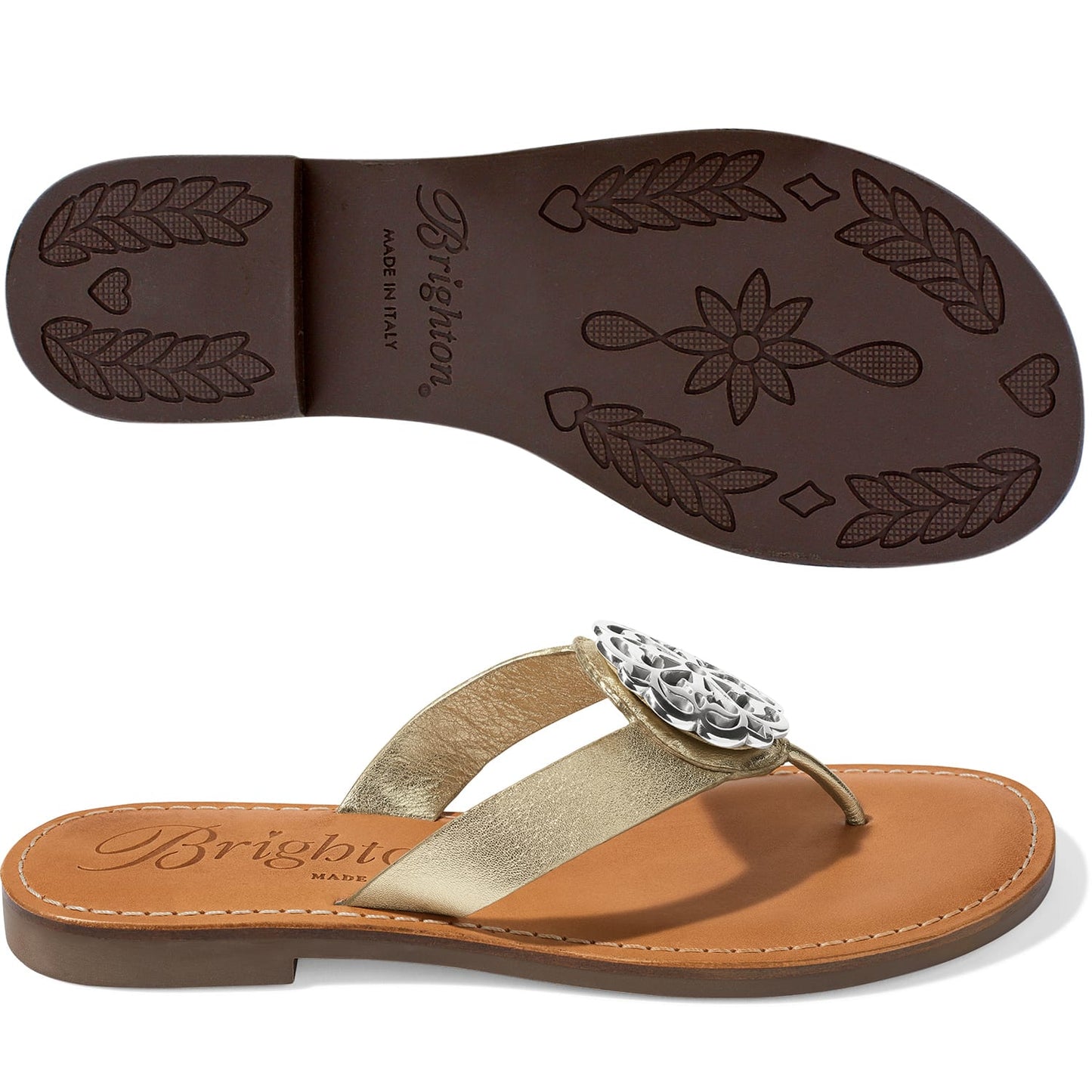 Brighton thong sandals with gold metallic strap, silver-tone medallion accent, and patterned brown sole on a white background