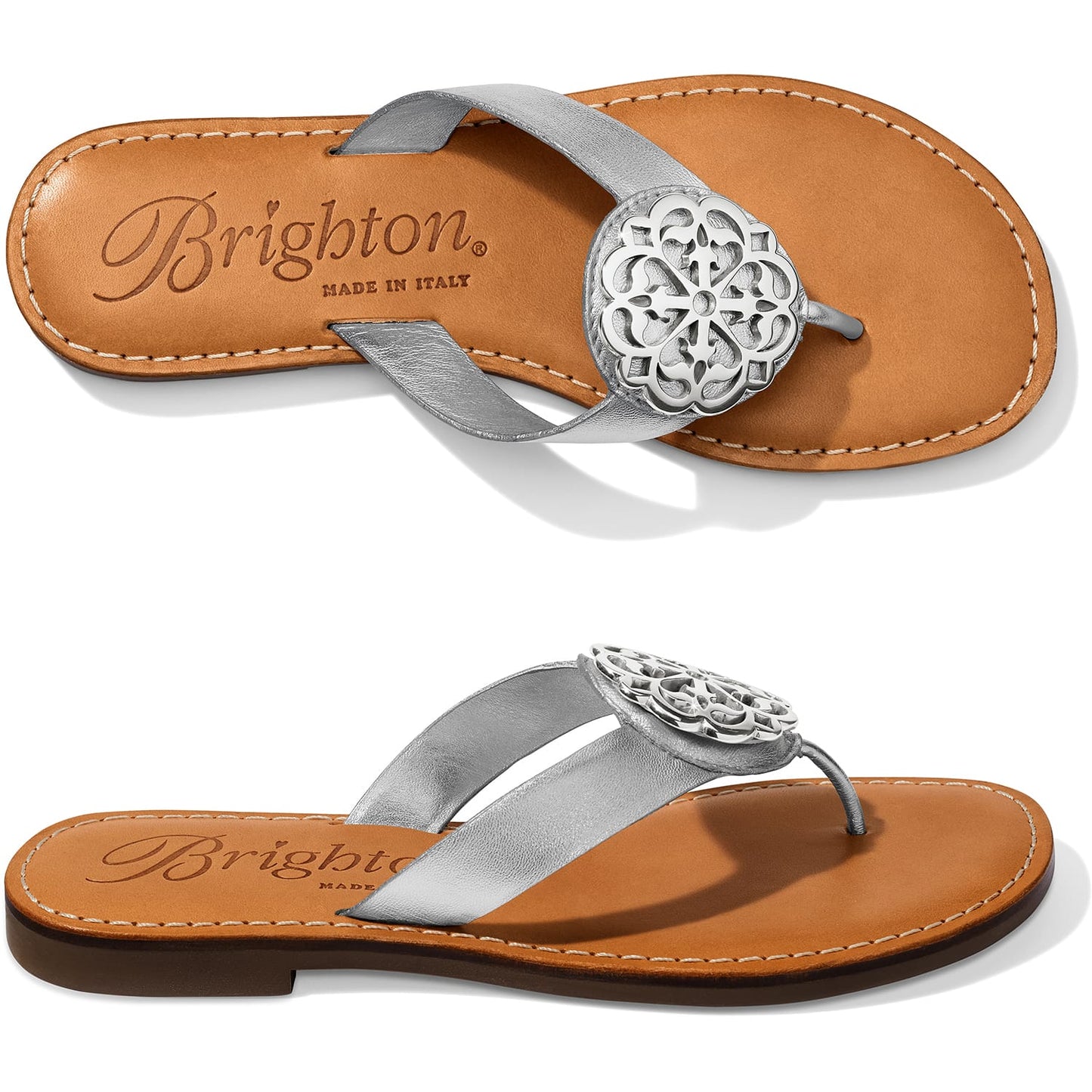 Brighton silver thong sandals with ornate silver-tone medallion accent and tan leather footbed on a white background