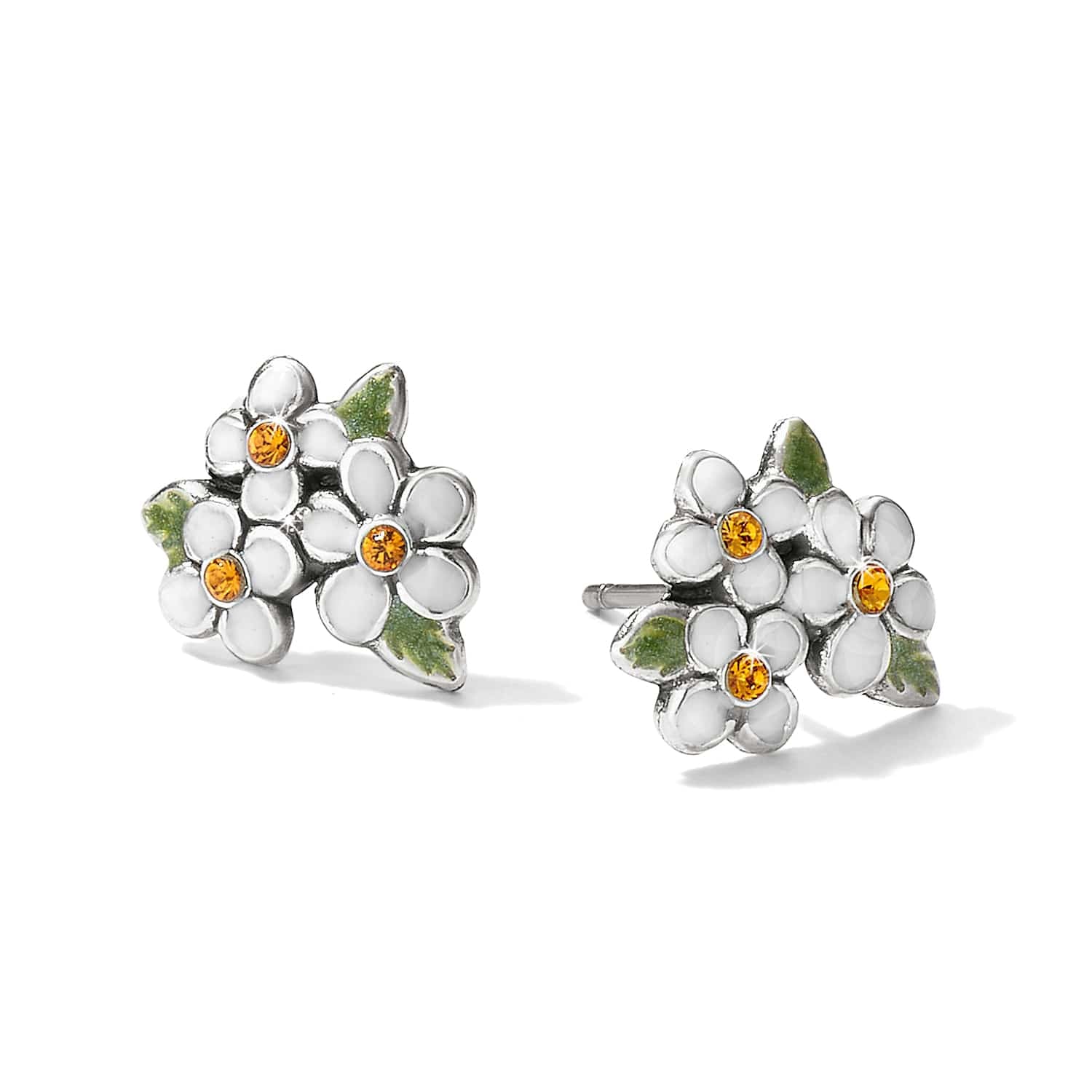 Brighton stud earrings with white enamel flowers, amber crystal centers, and green leaf accents on a white background