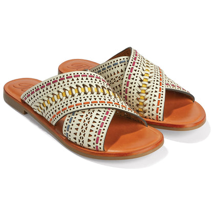 Brighton crossband slide sandals in ivory leather with multicolor woven stitching and tan footbeds on a white background