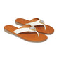 Brighton thong sandals in white leather with orange footbeds and silver-tone heart accents on a white background
