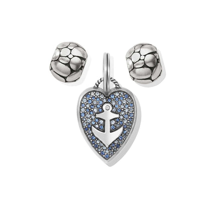 Brighton charm set with silver-plated anchor heart pendant with blue crystals and two textured bead charms on a white background