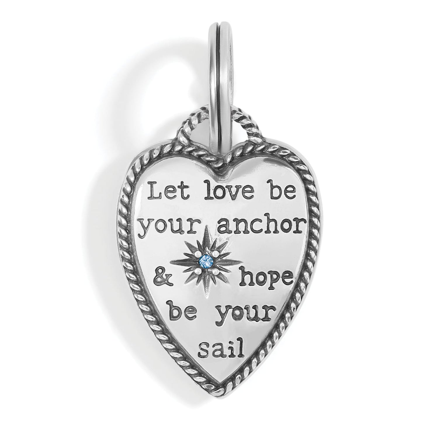 Brighton heart charm with silver-plated rope border, engraved inspirational message, and blue crystal star accent on a white background