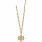 Brighton pendant necklace with gold-tone chain and openwork scrollwork flower pendant on a white background