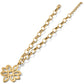 Brighton pendant necklace with gold-tone chain and openwork floral scroll pendant on a white background