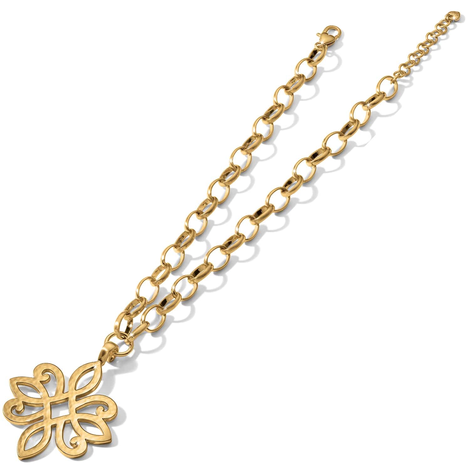 Brighton pendant necklace with gold-tone chain and openwork floral scroll pendant on a white background