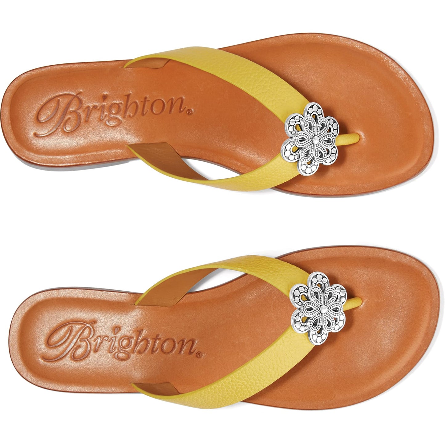 Brighton yellow leather flip-flop sandals with silver-tone floral medallion accent and tan footbeds on a white background