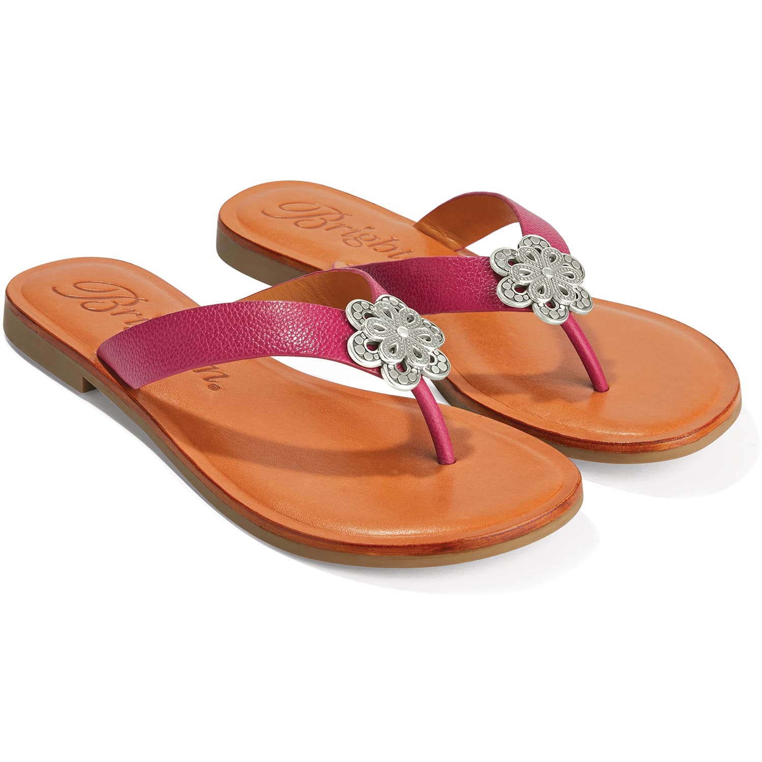 Brighton thong sandals with pink leather straps and silver-tone floral medallions on tan footbeds on a white background