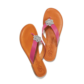 Brighton pink leather thong sandals with silver-tone floral medallion accents and tan footbeds on a white background