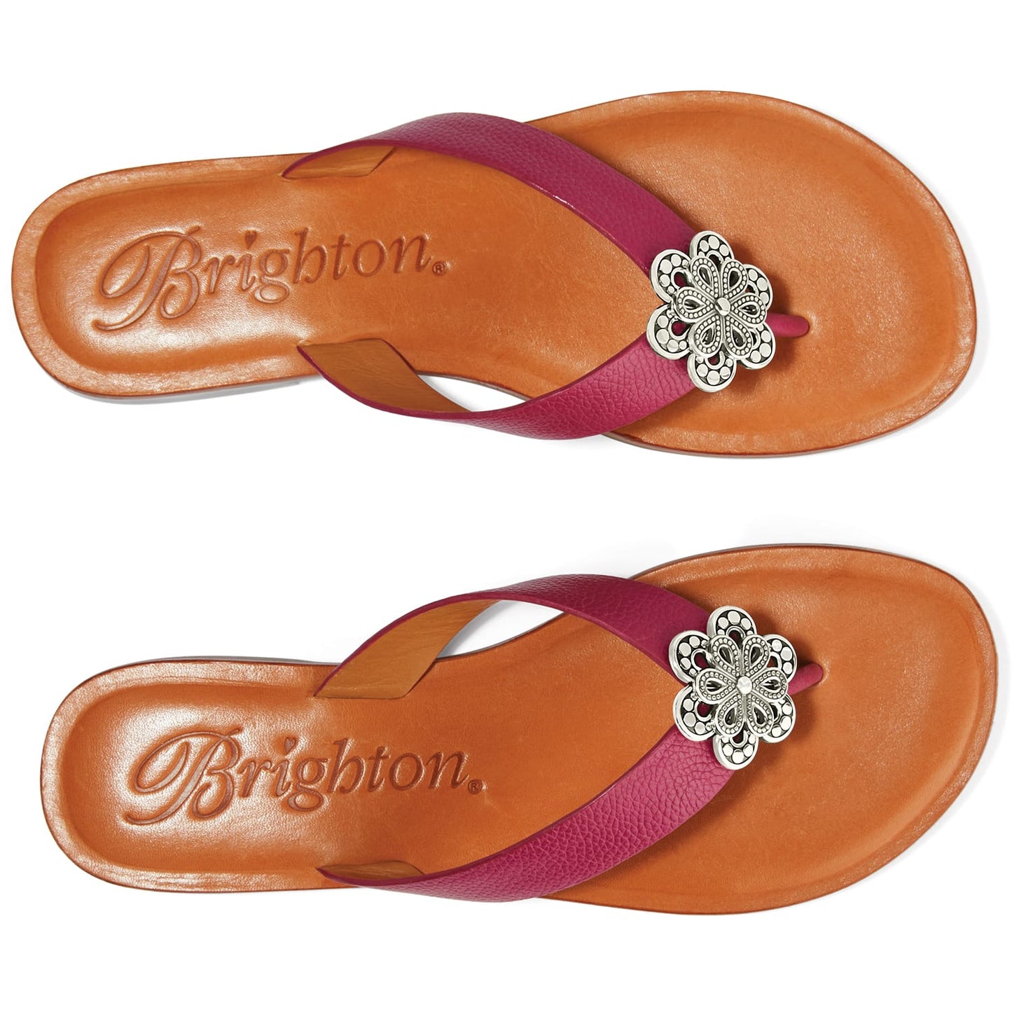 Brighton pink leather thong sandals with silver-tone floral medallion accent and tan footbed on a white background