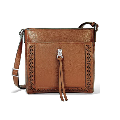 Brighton crossbody handbag in brown leather with woven stitch trim, knot accent, and adjustable strap on a white background