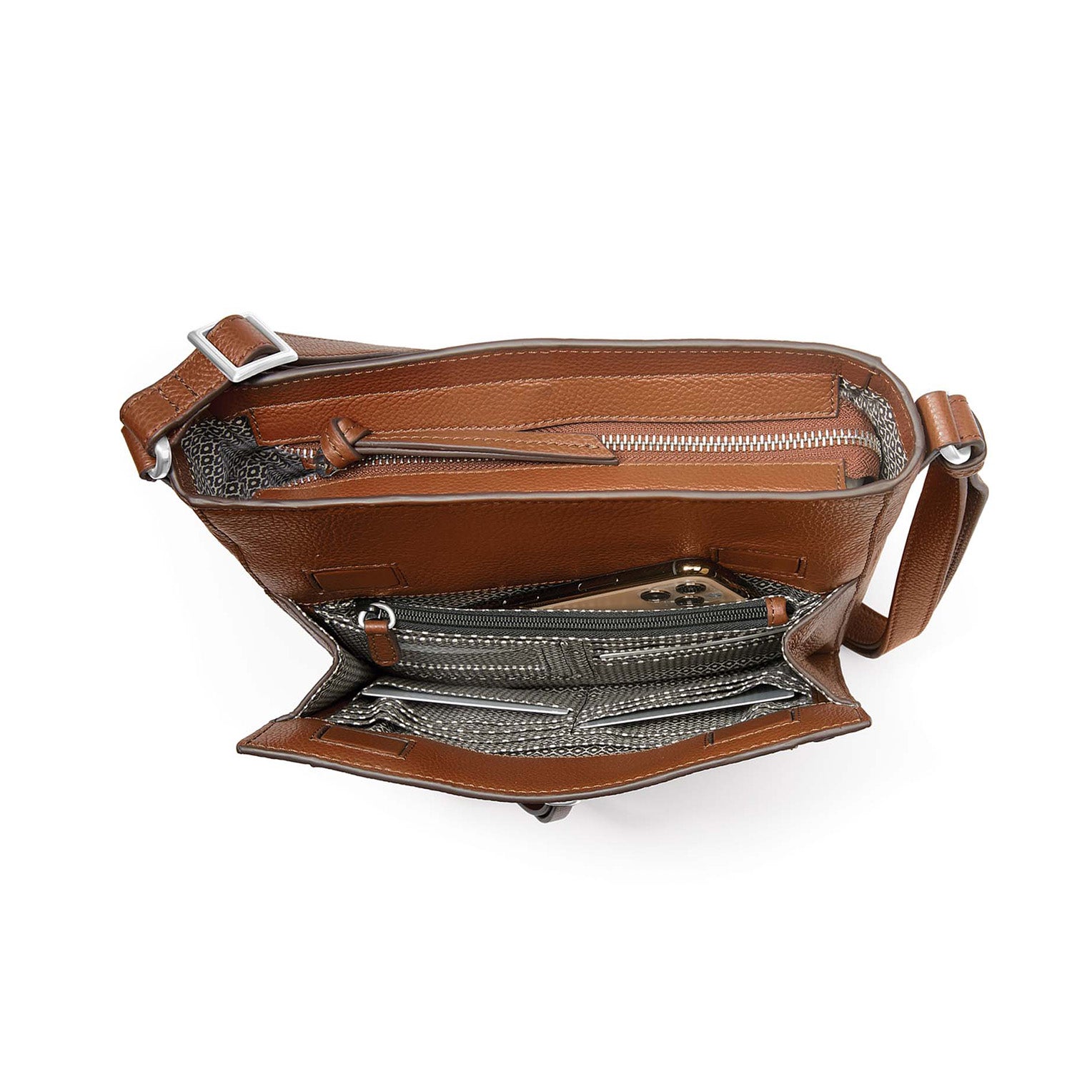 Brighton brown leather handbag interior view showing zip pocket, card slots, and patterned fabric lining on a white background