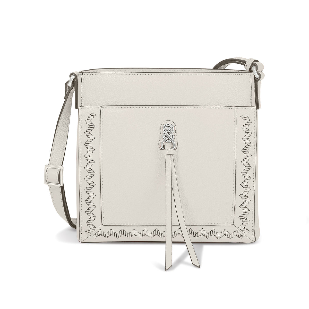 Brighton crossbody handbag in cream leather with whipstitch trim, silver-tone knot accent, and tassel pull on a white background
