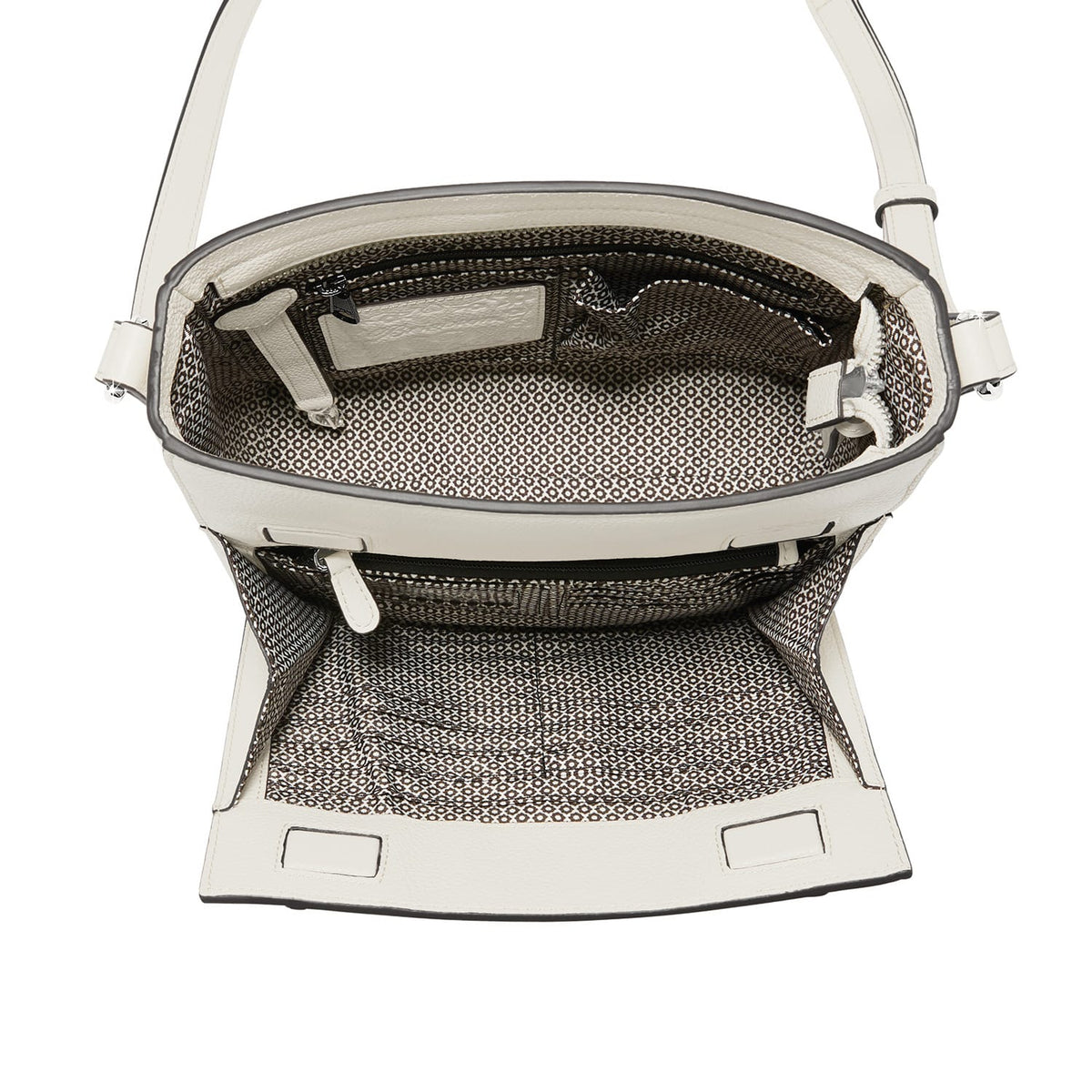 Close-up of Brighton white leather handbag interior view showing patterned fabric lining and zippered pocket