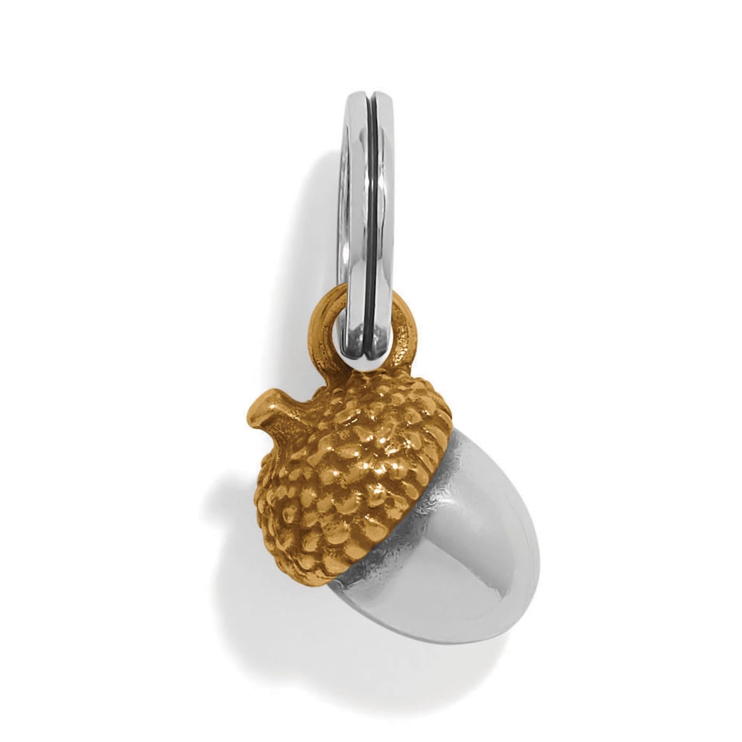 Brighton acorn charm with gold-tone textured cap and silver-tone body on a split ring on a white background