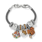 Brighton charm bracelet with two-tone beads, crystal accents, acorn, autumn leaf, and squirrel charms on a white background