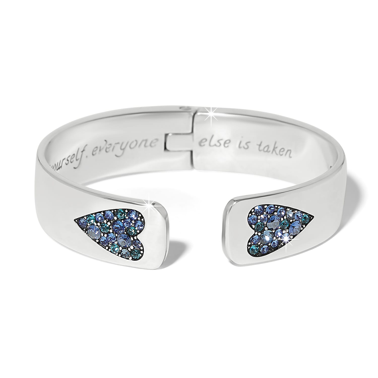 Brighton hinged cuff bracelet with silver-plated finish and blue crystal heart accents at open ends on a white background