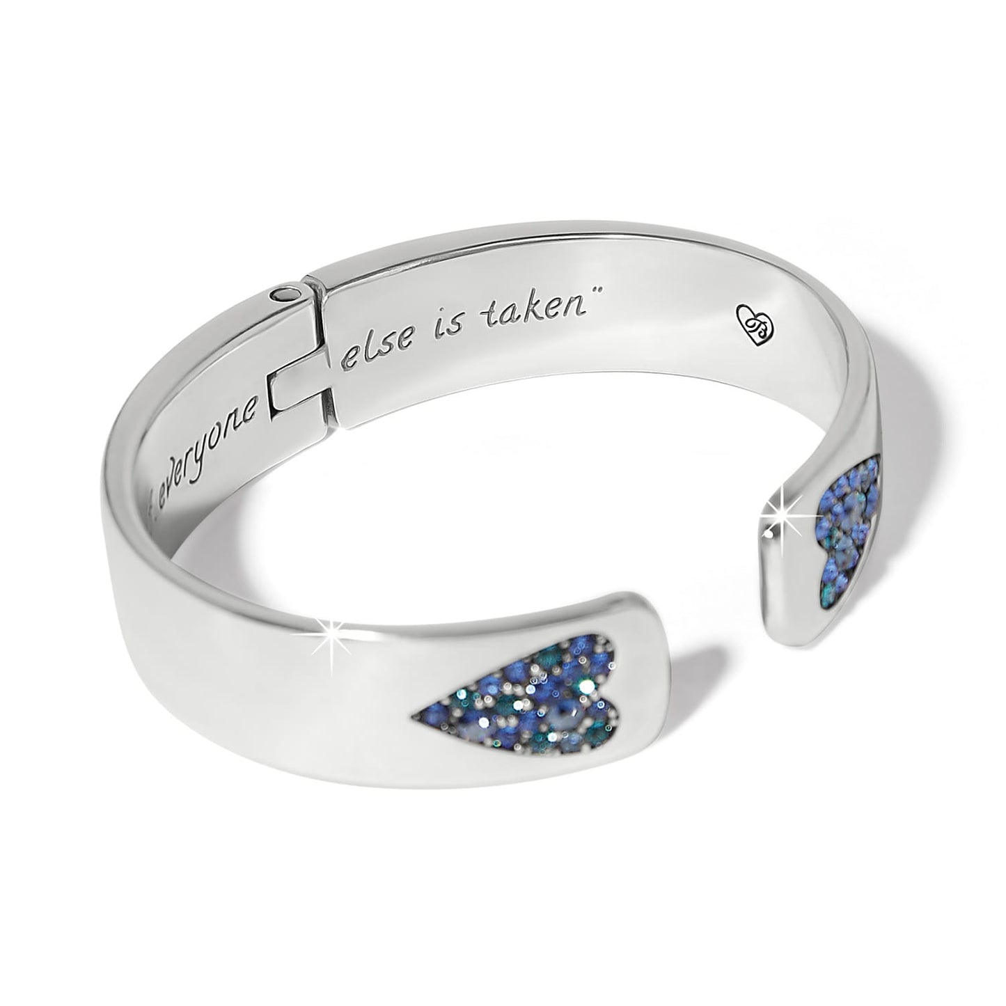 Brighton silver-plated hinged cuff bracelet with blue crystal heart accents and engraved interior message on a white background
